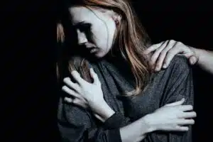 A woman suffering from PTSD symptoms.