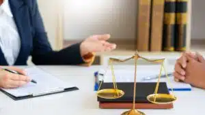 A solicitor helping a client make a manual handling injury compensation claim.