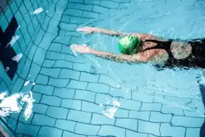 A woman swimming in a swimming pool.